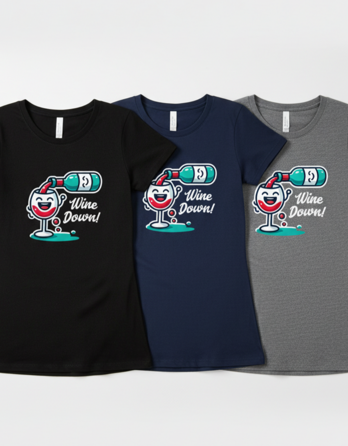 Three women's short-sleeve graphic T-shirts shown flat against a light gray background: black, navy, and heather gray. Each shirt features a cartoon wine glass with a bottle, a red heart, and the text 'Wine Down!'.