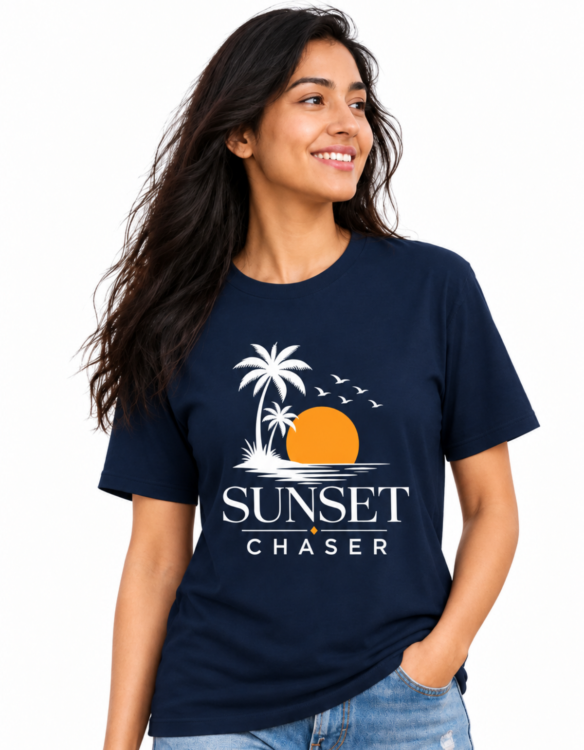 A woman wearing a navy blue graphic t-shirt with a white and orange sunset beach design and the text 'SUNSET CHASER'.