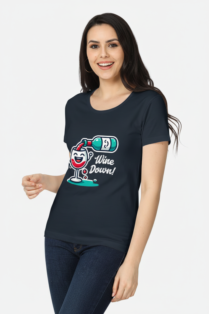 A woman modeling a dark navy blue t-shirt with a graphic of a smiling wine glass holding a bottle and the text 'Wine Down!'.