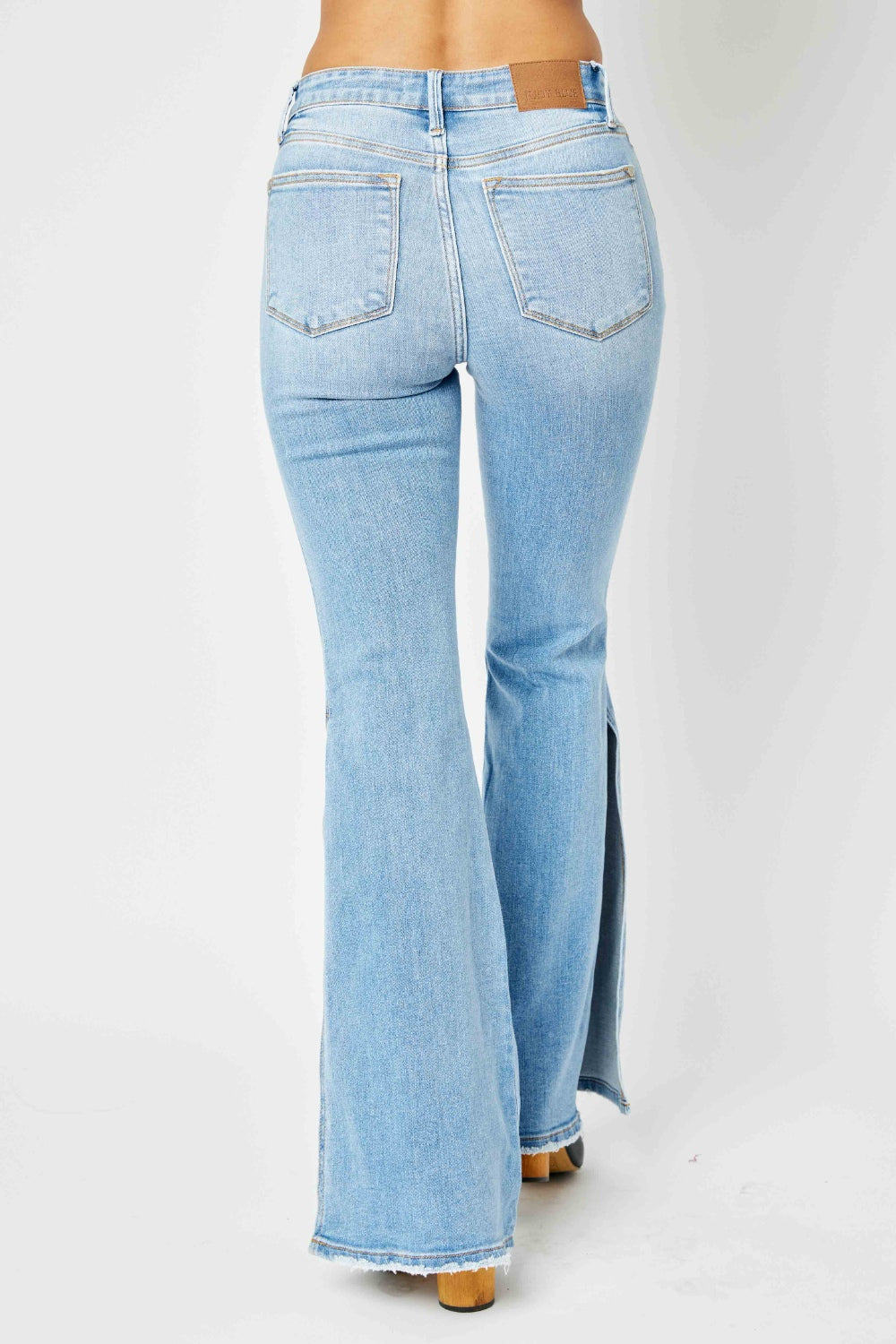 Judy Blue Full Size Mid Rise Raw Hem Slit Flare Jeans - TRENDMELO