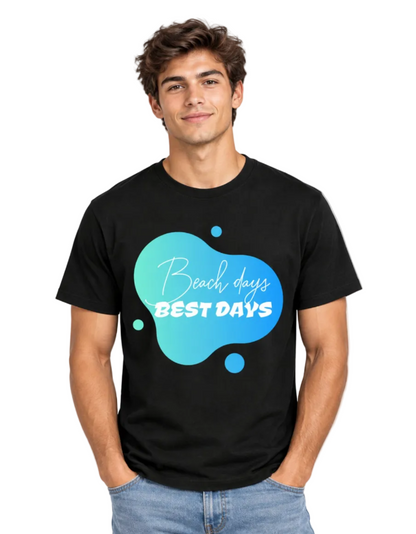 A man wearing a black short-sleeve t-shirt with a blue and teal abstract bubble graphic on the chest that reads 'Beach days BEST DAYS' in white script and block lettering, paired with light blue jeans against a plain white background.