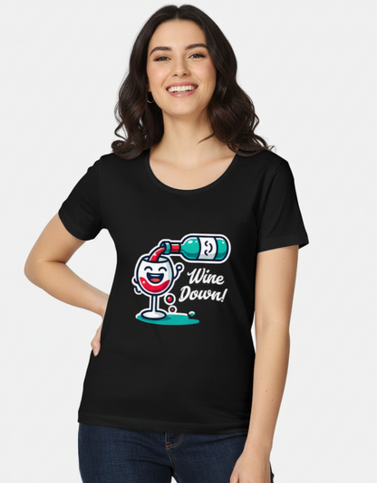 Front view of a female model wearing the black Wine Down graphic T-shirt in 180 GSM super-combed cotton, featuring a cute wine bottle and glass illustration.