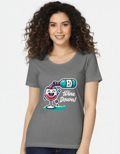 Female model wearing the charcoal melange gray Wine Down graphic tee for women, crafted from pre-shrunk cotton.