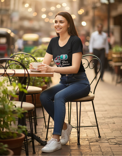 A woman wearing the black Wine Down graphic tee outdoors paired with denim and white sneakers for a casual weekend brunch look.